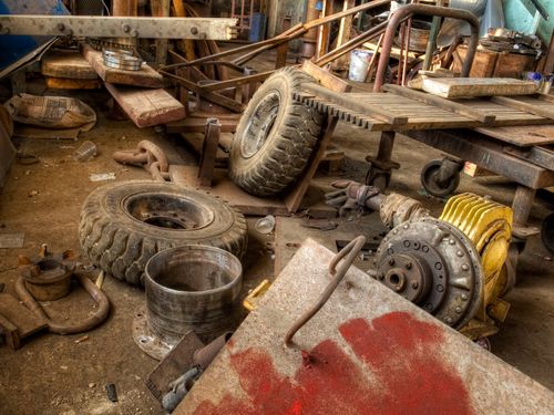 messy construction site with tires and lumber